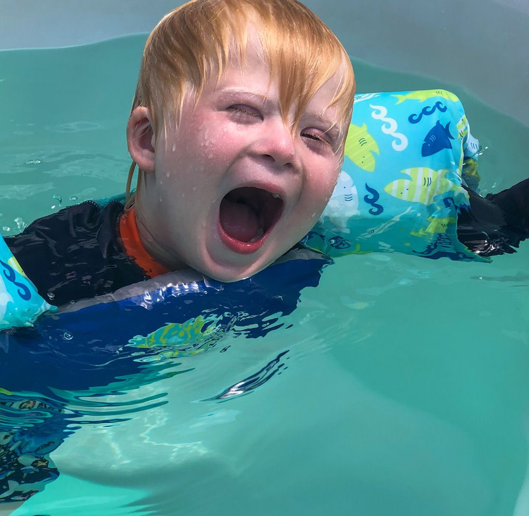 picture of a boy with Down syndrome and autism doing Endless Pools therapy